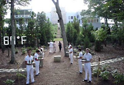 Waiters greeted guests at the entry to the event with miniature bottles of Moët & Chandon Champagne amid a fluorescent bulb and mirror work by Laurent P. Berger.