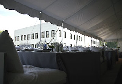 Three sides of the dinner tent featured raised platforms with banquette seating.
