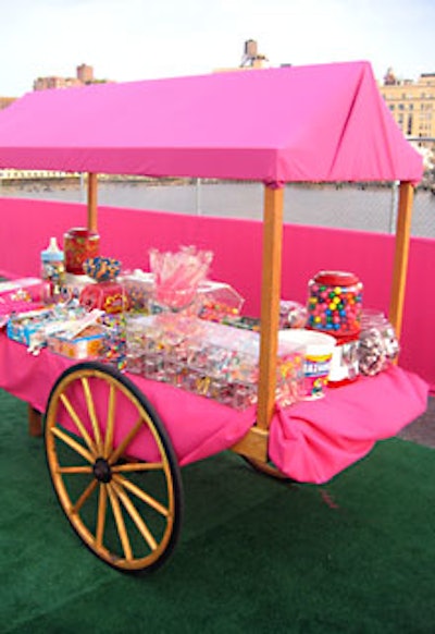 Draped in bright pink fabric, another cart held a large assortment of pink candy.