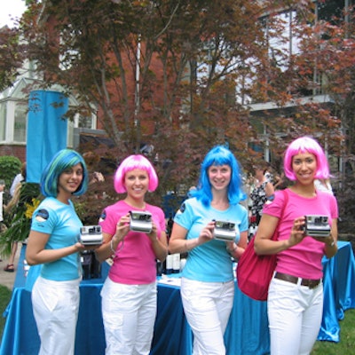 Gals in pink and blue wigs snapped Polaroid photos of guests.