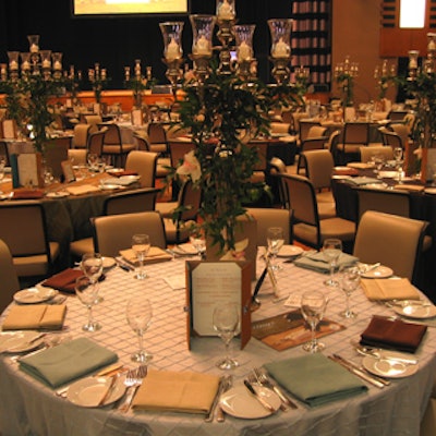 Candelabra centrepieces from Forget Me Not Flowers with adorning blooms from Flowers by Margaret topped regal-looking tan, beige, and stone blue linens from Around the Table.