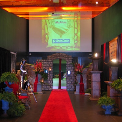 A red carpet, flower arrangements and greenery from Eden Planning, and a brick archway decorated the front entrance.