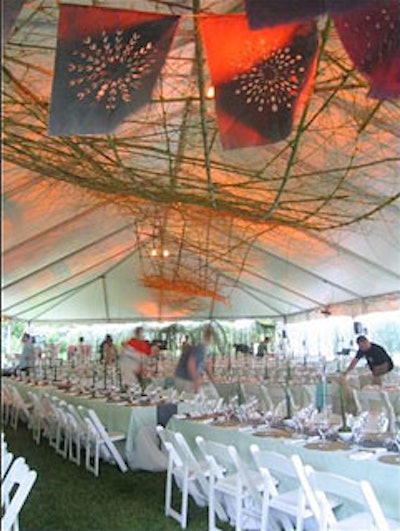 Suter stripped more than 100 bamboo stalks and wove together an undulating structure to hang from the tent ceiling.