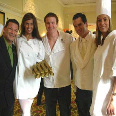 The JW Marriott's Nector Collazo stopped to pose with the chefs before continuing to usher guests into the 'Iron Chef' phase of the evening.