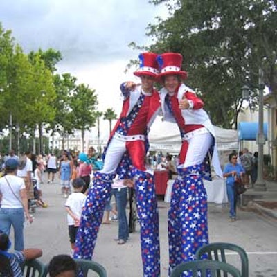 Stilt-walkers posed for the camera before mingling with guests.
