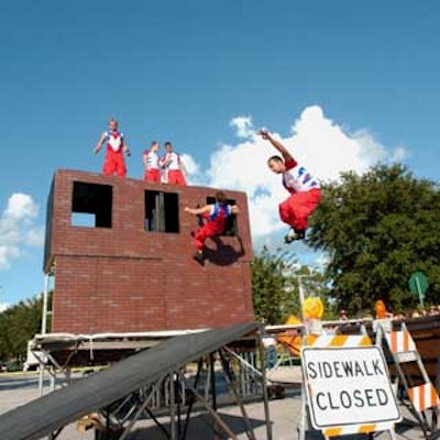 The members of Extreme Acrobats jumped off a faux building onto a trampoline as skaters performed tricks off a ramp.