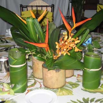 Harkey Event Productions arranged one of three centerpieces with lush tropical florals.
