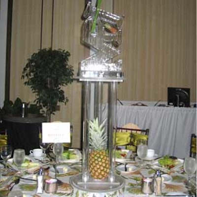 So Cool Events' ice sculpture centerpiece sat atop an acrylic pedestal adorned with pineapples to match the tropical theme.
