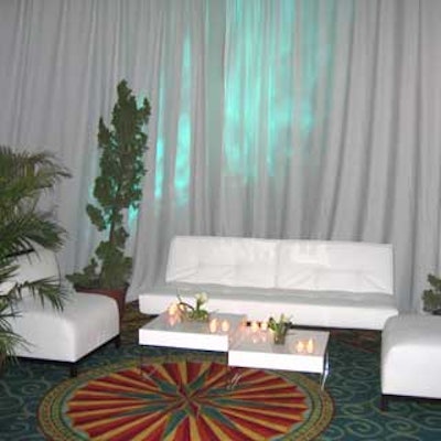 Furniture vignettes from Event Furnishings & Decor were set up in the corners of the ballroom and adorned with pine and palm trees from Jeren Foliage.