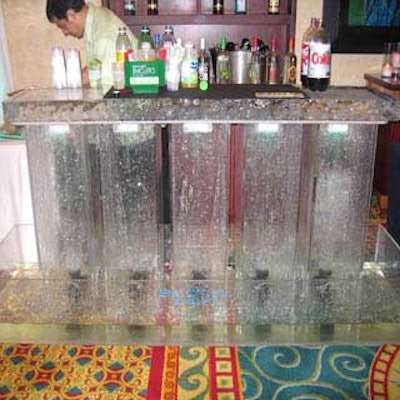 The new ice bar from So Cool Events featured a lit acrylic base with water fountains and a slab of ice as the bar top.