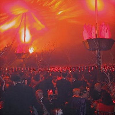 Within a tent from Stamford Tent & Party, Baloun hung red lights and decorated tables with dead tree branches.