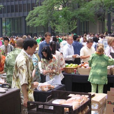 Volunteer staff from TD Bank Financial Group served food to paying guests at the annual TD Challenge Barbecue fund-raiser for Ontario March of Dimes in the TD Centre Courtyard.