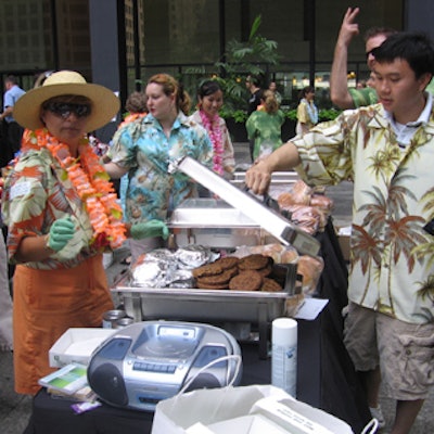 Servers sported Hawaiian shirts and leis at one of two Hawaiian theme barbecue stations.