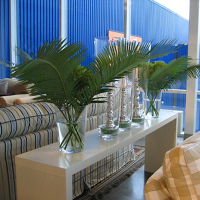 Candles and greenery adorned occasional tables used to separate the lounge areas.