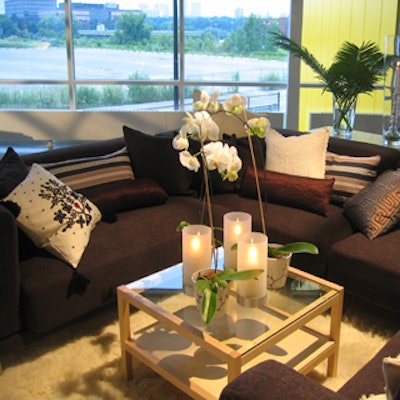 Orchids and candles created a mellow mood in a lounge decorated with earth tones.