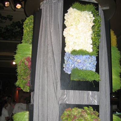 Designs by Sean made vertical floral arrangements that hung on the wall to decorate the food stations and save some much-needed space.
