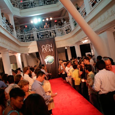 The fashion show took place on a red-carpeted set with a heavily logoed backdrop on the first floor of the Moore Building.