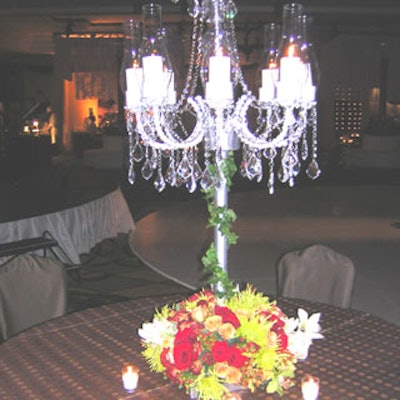 Table centerpieces consisted of ornate chandeliers with colorful floral arrangements.