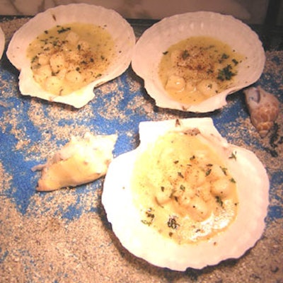 The chefs at the Ritz served scallops with a garlic butter cream sauce in seashells.