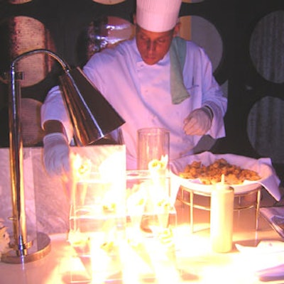 One chef prepared fresh calamari and presented it in paper cones.