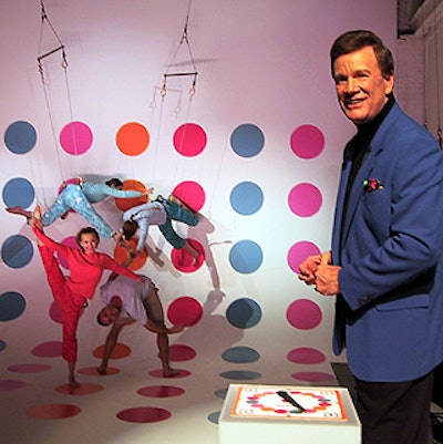 Game show veteran Wink Martindale hosted a Twister game played by gymnastics troupe Antigravity.