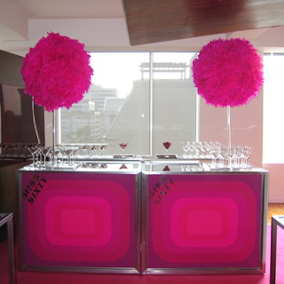 Feathery pink decor elements adorned the bar.