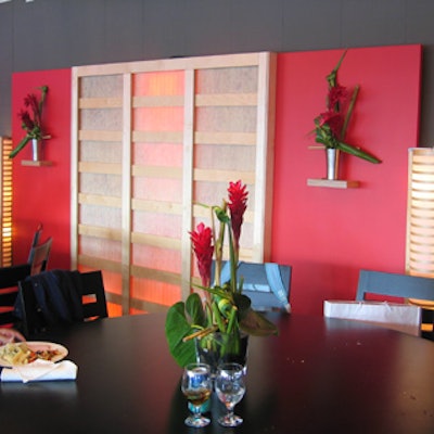 Bird-of-paradise bouquets topped most of the horizontal surfaces in the Roger Cup lounge, including the round, black-lacquered dining tables.