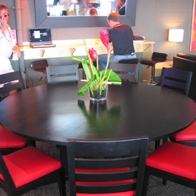 Bird-of-paradise bouquets topped most of the horizontal surfaces in the Roger Cup lounge, including the round, black-lacquered dining tables.