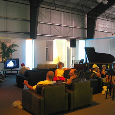 The PricewaterhouseCoopers bistro included a lounge area with couches from Harvest House, a baby grand piano from Robert Lowrey's Piano Experts and televisions from Samsung.