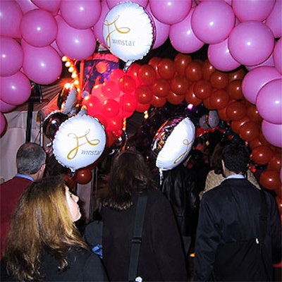 Partygoers walked through balloons from Inflatably Yours on their way to the Big Apple Circus gala.