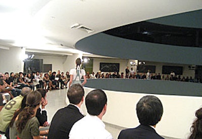 Some 600 guests sat on benches lining three sloping levels of the Guggenheim's rotunda, watching the models embark on their two-and-a-half-minute walk down the runway.