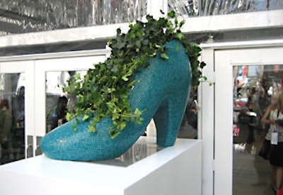 Fancifully adorned planters in the shape of shoes featured Sicis mosaic tiles.