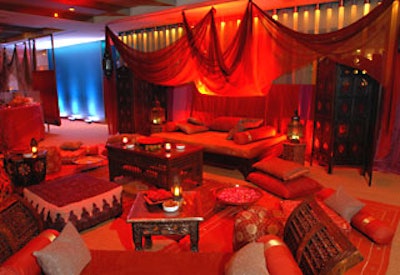 Seating areas filled with ottomans, pillows, and soft fabrics allowed guests to lounge and partake in the abundant supply of food and drink.