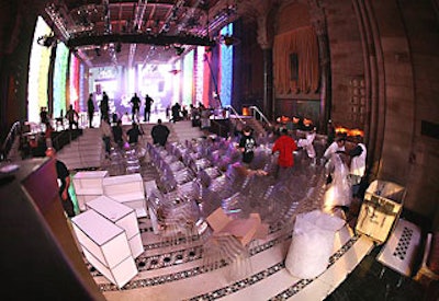 Stacks of chairs were brought into the venue to be placed alongside the runway.