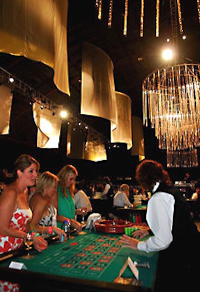 In the center of the cavernous room were tables for blackjack, roulette, poker, and craps.
