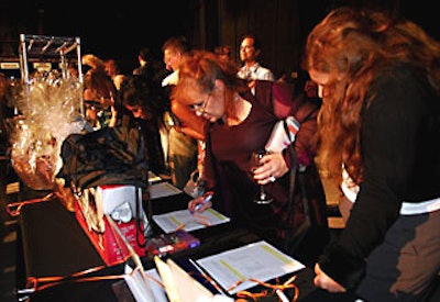 Near the entrance were tables of silent-auction items benefiting Step Up Women’s Network.