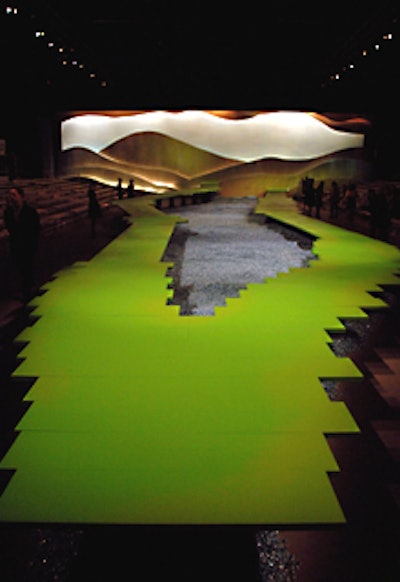 Marc Jacobs’ intense green runway was a crooked path elevated over a shimmering field of wrapped candies.