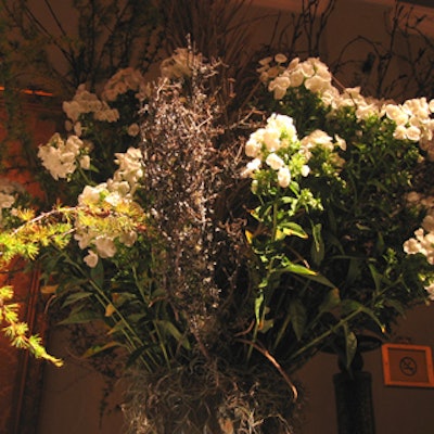 Florals from Emblem decorated the buffet tables in the secondary event space.