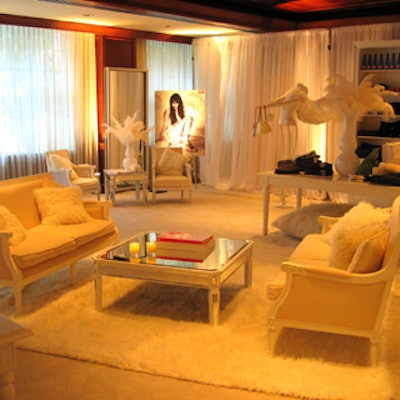 White curtains, a white carpet, and Regal, white two-seater couches from McNabb Roick Events helped create a heaven-meets-old-world-elegance vibe in the Diesel Canada celebrity gift lounge at Intercontinental Hotel Yorkville during the Toronto International Film Festival.