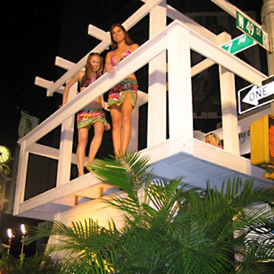 Models danced on top of a giant lifeguard stand outside of the new Hawaiian Tropic Zone restaurant.