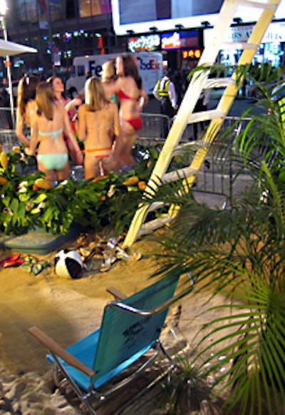 The beach scene included a hot tub lined with tropical plants—and more models.