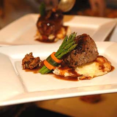 Filet mignon-topped with a red wine and mushroom reduction-served with a baked gratin of potatoes and fresh asparagus spears topped with hollandaise sauce was the main course.