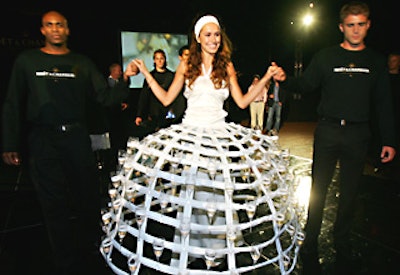 Two pompommes girls came out later in the evening, wearing hoop skirts that had tiers of Champagne glasses for guests to take.