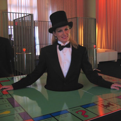 A model showcased a Monopoly board at First Canadian Title's Monopoly-theme client appreciation party at Liberty Grand.