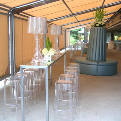 A silver settee topped by florals occupied the centre of the covered patio reception space.