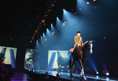 A model on a trotting horse made her way down the runway.