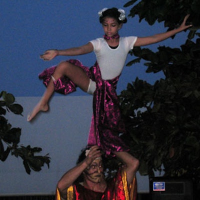 Ten-year-old Emma Suman pulled-off extraordinary feats in her debut public acrobatic show. Here, she can be seen balancing on one leg, while being held up by Paul Anderson.