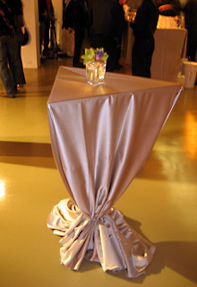 Shaffer wanted the pyramid shape of the tea bags to carry through the event, as in the triangular highboy cocktail tables.