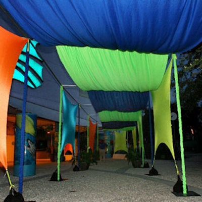 This green, blue, and orange custom-built tunnel guided guests from the entrance to the main lobby.