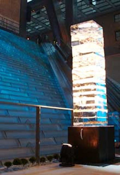 To parallel the entrance’s two-story-high waterfall, two tiered ice sculptures layered with fall leaves stood at the foot of the escalators.